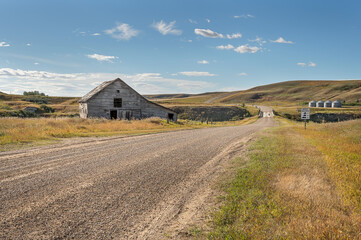 Abandoned barn on a country road at Sharples, Alberta, Canada