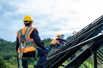 Poster - Engineer wearing safety harness and safety line working at high place at construction sites,Engineering tools and construction concept.
