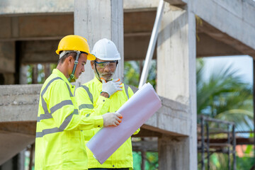 Aufkleber - Architects and engineers with blueprint discussing work at new construction sites,Engineering tools and construction concept.