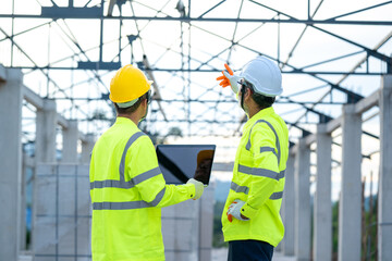 Aufkleber - Engineer using laptop working on building site,Construction concept.