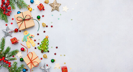 Wall Mural - christmas background with gift boxes, festive decor, fir tree branches and paper cards notes. flat l