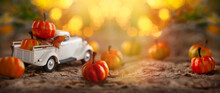 White Retro Truck With Pumpkins In Forest With Festive Bokeh Background. Concept Of Thanksgiving Day, Halloween And Autumn Postcards.