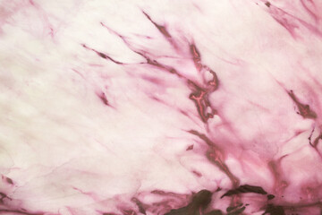 Wall Mural - Close up of a magenta pattern on silk texture - fashion background - studio shot from above 