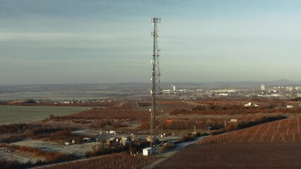 Wall Mural - Communication transmitter tower in the countryside aerial view drone footage. Cellphone network antennas.