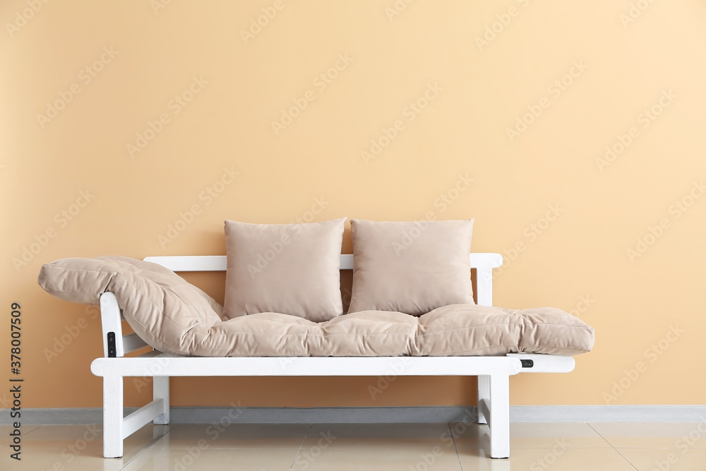 Stylish modern sofa in room