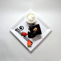 Sticker - Top view of a piece of chocolate cake on a plate isolated on a white background