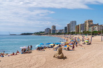 Big Beach of Aro at day of summer with some white clouds.