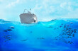 Small boat in the sea. Large school of fish in the ocean. Underwater world with sea animals.
