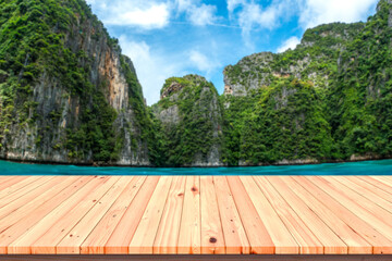 Wall Mural - Wooden floor or plank on sea in summer. For product display.Calm Sea and Phi Phi Island Background.