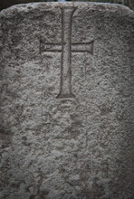 Simple Cross Carved In Stone.  Modest Christian Symbol On An Old Sandstone Grave. 