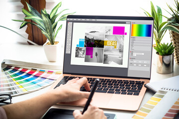Poster - graphic designer working on a laptop