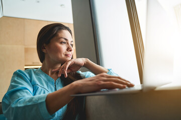 Wall Mural - Lovely serene woman freelancer working from home