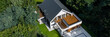 © Dariusz Jarzabek - Drone view of house in forest, panorama