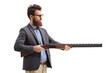 Bearded man aiming with a shotgun