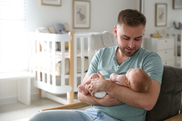 Poster - Father with his newborn son at home