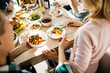 © Yakobchuk Olena - Man pouring food to his girlfriend at home