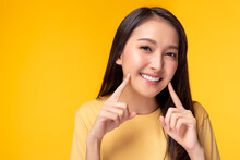 Beautiful Woman Has Beautiful Tooth, White Teeth, Nice Tooth Alignment. She Get Her Teeth Cleaned. Pretty Girl Show Her Teeth. Copy Space, Yellow Background