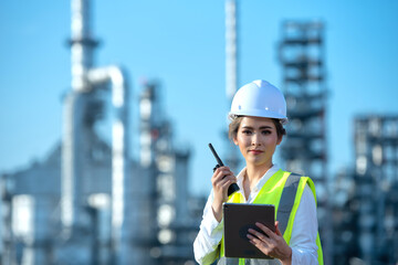 Engineer inspecting in industrial oil refinery. Industry 4.0 concept. Background blurred concept.