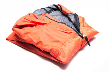 folded orange zipper windbreaker jacket, rain proof and waterproof hiking gore-tex jacket hoodie. tr
