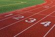 © Rialto Images/Stocksy - Track and field race track with individual lanes