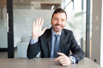 screenshot of businessman having a video call in office