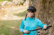© carballo - woman with bicycle and helmet outdoors