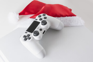 Wall Mural - 
White game console and controller with Santa Claus hat