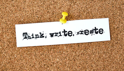 Wall Mural - Think, write, create. Text written on a piece of paper, cork board background.