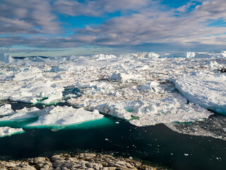 Wall Mural - iceberg and ice from glacier in arctic nature landscape on greenland. aerial photo drone photo of ic