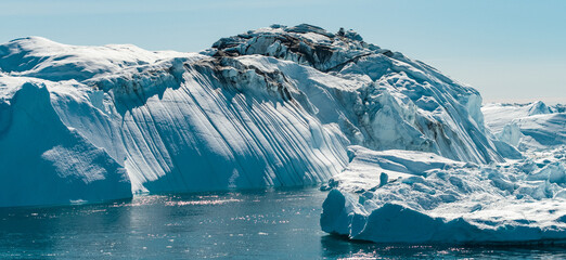Wall Mural - icebergs in greenland - global warming and climate change concept.