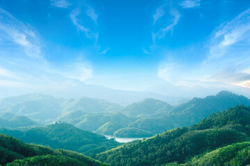 Wall Mural - World environment day concept: Green mountains and beautiful blue sky clouds