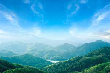 World environment day concept: Green mountains and beautiful blue sky clouds