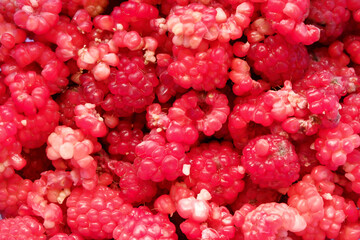 A scattering of crushed raspberries for making jam.