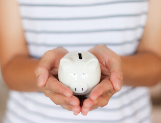 Saving pig piggy bank in hand Convey to savings