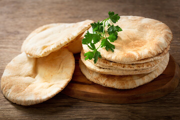 Wall Mural - pita bread on a wooden table