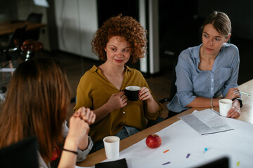 Businesswomen working on a new project. Colleagues discussing about problem they have to solved.