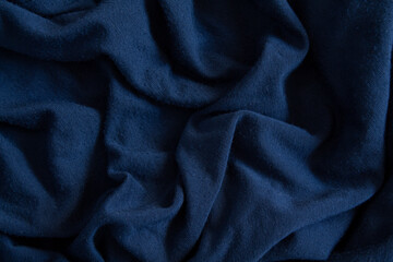 Crumpled blue satin fabric. Texture