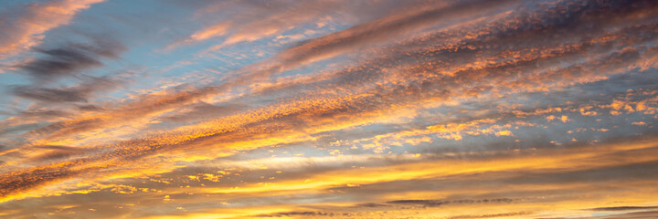 Wall Mural - colorful sky with clouds at sunset, panoramic nature background and web banner