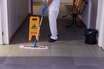 Conceptual photo of a hospital worker cleaning the ward