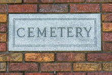 Cemetery Gate Pillar With Cemetery Engraved Into The Plaque.  Brick