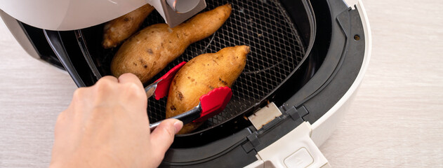 Wall Mural - Roasted sweet potato cooked by airfryer at home. Healthy food for diet eating.