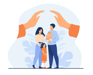 Hands protecting family with two children. Young couple of parents holding baby, standing together under human palms. For family safety, state protection, assistance, care concept