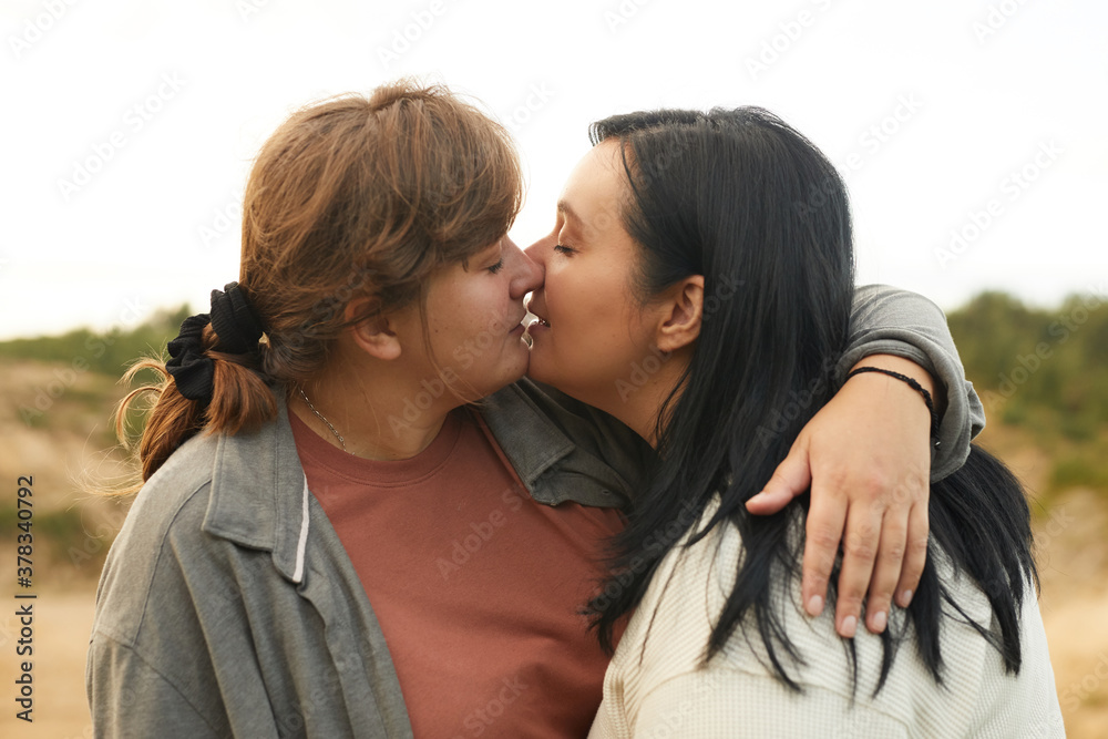 young lesbian kissing teen Two young lesbians kissing each other during their walk on the nature の  Stock フォト | Adobe Stock