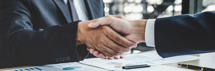 Poster - Teamwork partnership meeting concept, Two confident Business shaking hands after discussing good deal of trading contract and new projects for both companies