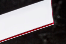 White And Red Multi-layered Thick Stock Business Card, Floating On A Black Background, A Mockup For Design Presentation