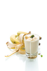 Wall Mural - tasty homemade yogurt with bananas in a glass isolated on white background