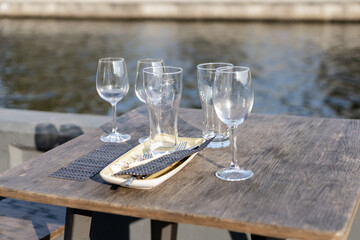 empty glasses on a table in a street restaurant