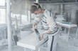 © amixstudio - The master engraves the tombstone. Stone processing