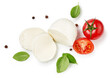 © Tatyana Sidyukova - Pieces of mozzarella Buffalo cheese with basil leaves. Top view of sliced cheese with tomatoes isolated on white background.