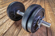 © MarekPhotoDesign.com - iron dumbbell on a grunge wooden deck - fitness concept